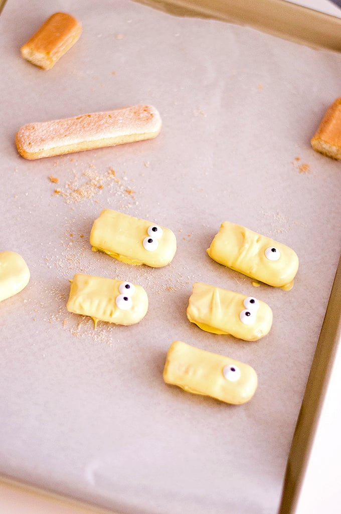 ladyfingers dipped in yellow coating to make Minion Cupcakes