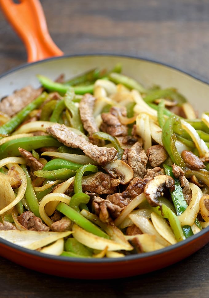 sauteed ribeye, mushrooms, bell peppers, and onions for Philly cheesesteak sliders