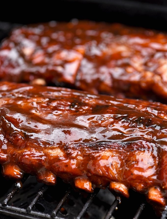 baby back ribs with cola BBQ sauce on the grill
