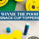 Applesauce cups topped with cut out Winnie the Pooh topper