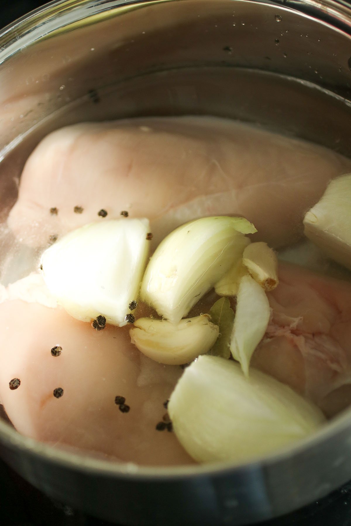 poaching chicken breast in a pot