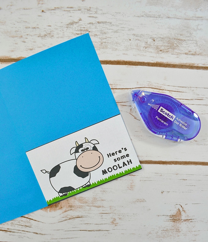 Glue the money holder to the inside of the printable cow card to hold a gift card or cash. 