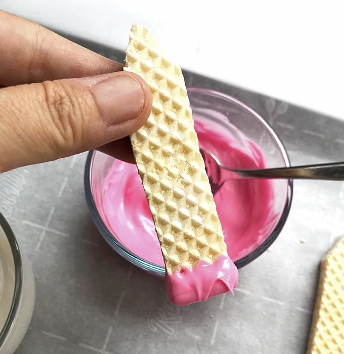 sugar wafer dipped in melted pink candy coating