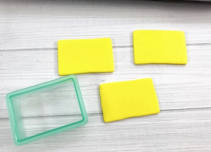 cut out yellow fondant rectangles to make School Bus Rice Krispies Treats