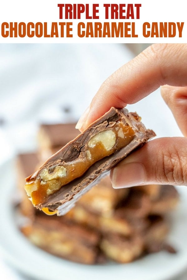 holding chocolate caramel candies with fingers