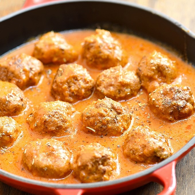 Meatballs with Creamy Tomato Sauce in a red skillet