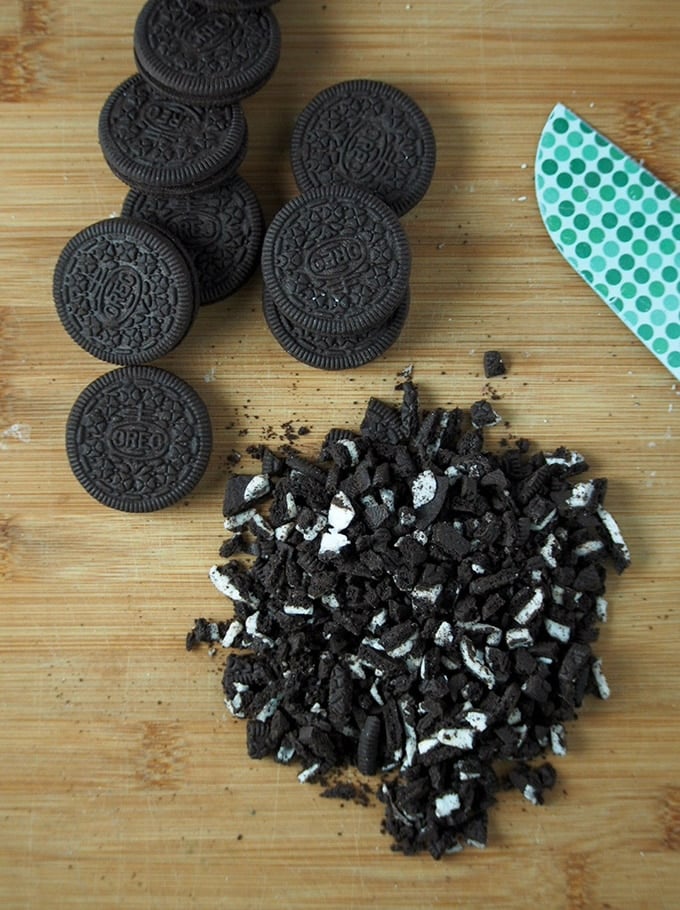 chopped Oreo cookies on a cutting board