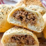 cut baked bread buns with sloppy joe filling