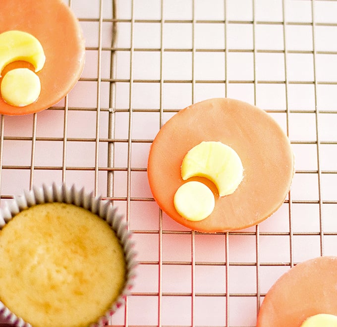 making Tigger-inspired cupcakes with vanilla cupcake and fondant