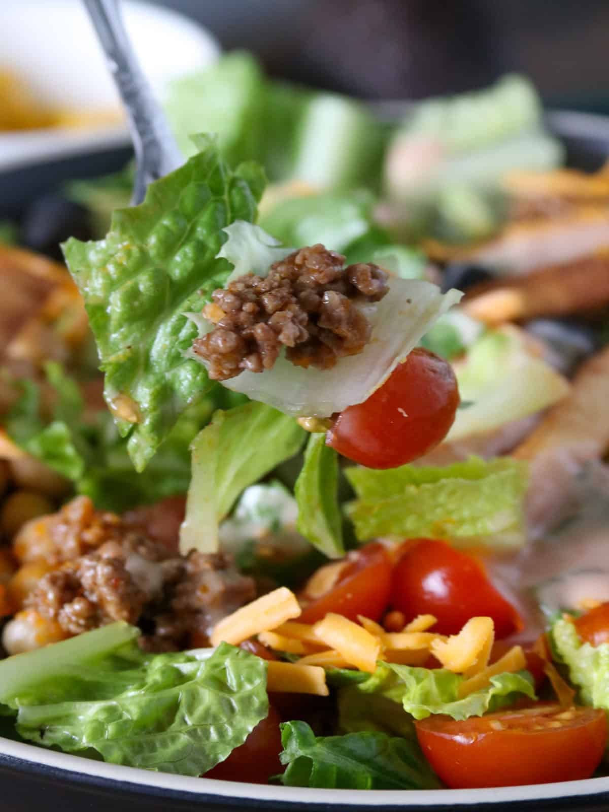 eating Taco Salad with a fork.