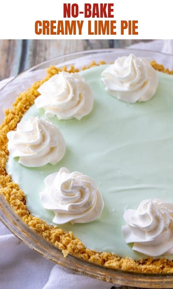 Frozen Margarita Pie with whipped cream in a clear pie plate