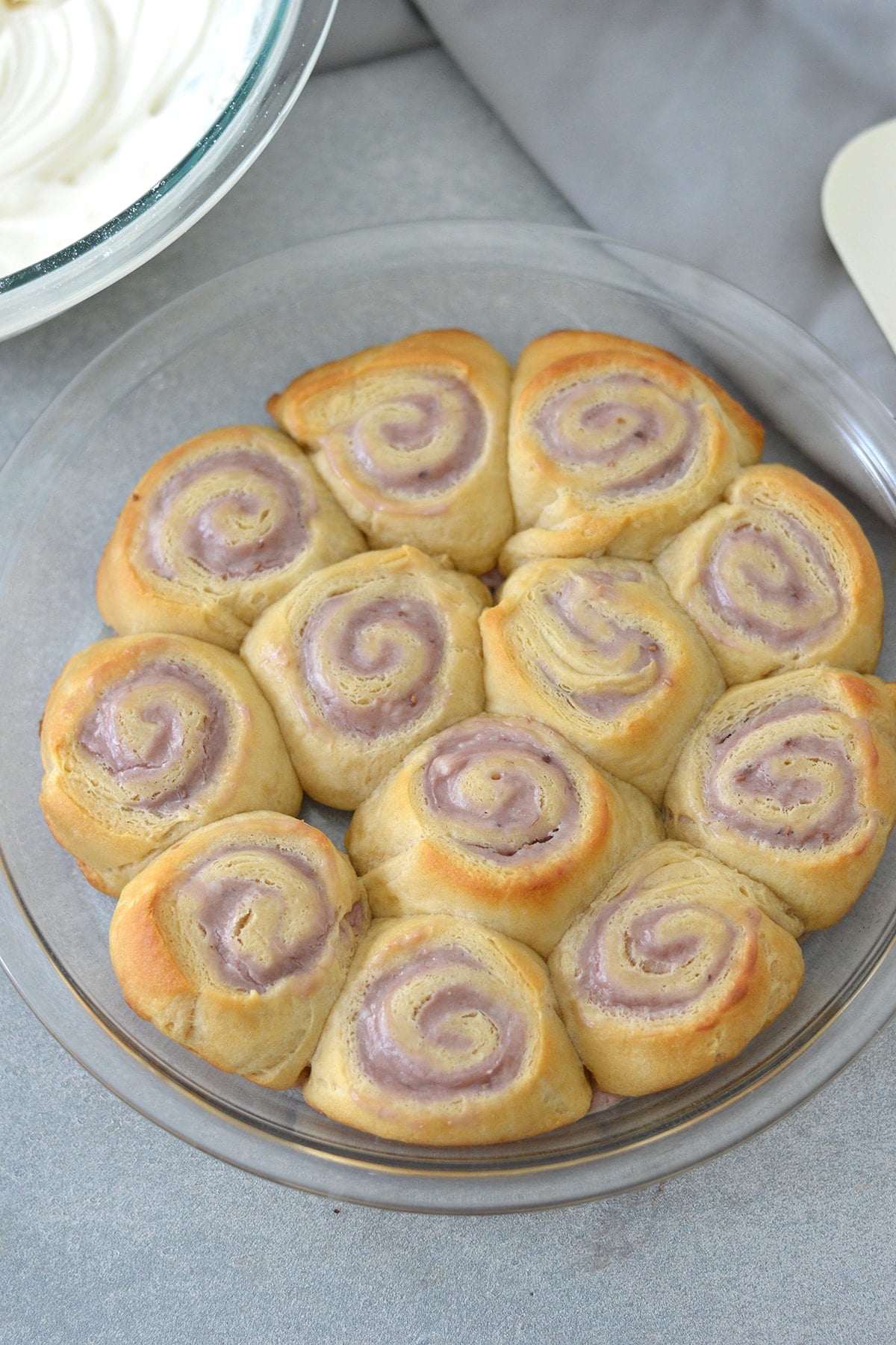 cheese danishes baked in a round glass pan.