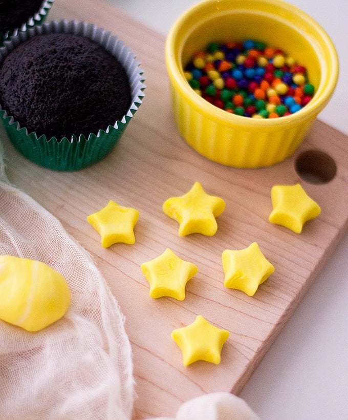 yellow fondant stars, chocolate cupcakes and colored candies