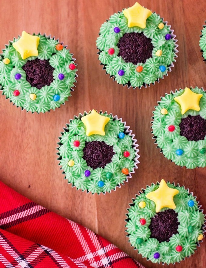 chocolate cupcakes decorated as Christmas wreaths