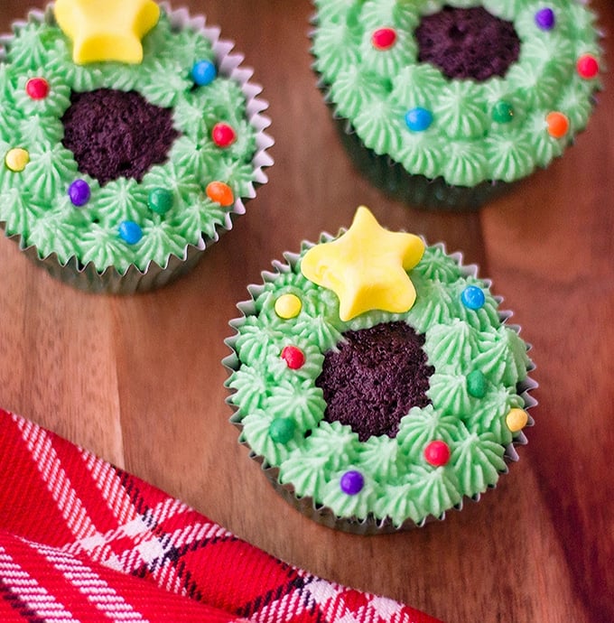 Christmas Wreath Chocolate Cupcakes on a wood board