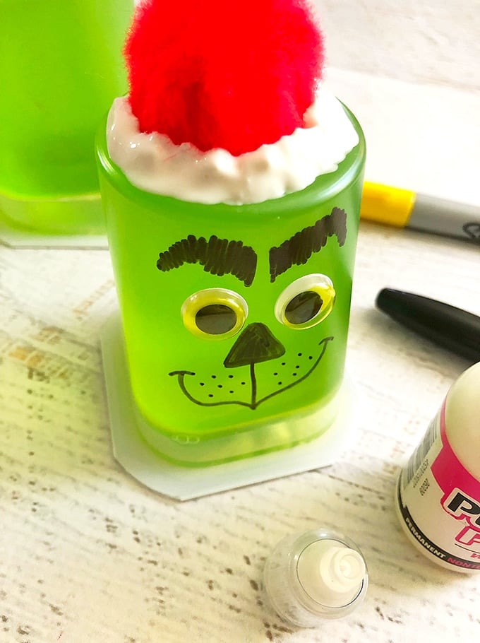 these Grinch Jello Cups are an easy craft to add some fun to your kids' snack