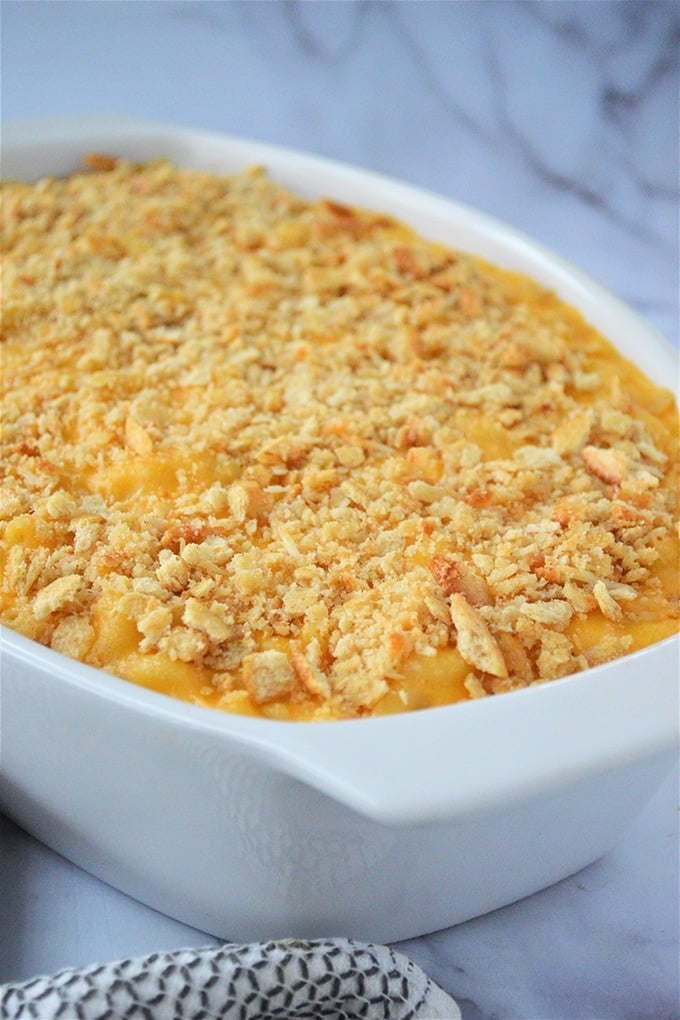 Homemade Macaroni and Cheese baked in a white casserole dish
