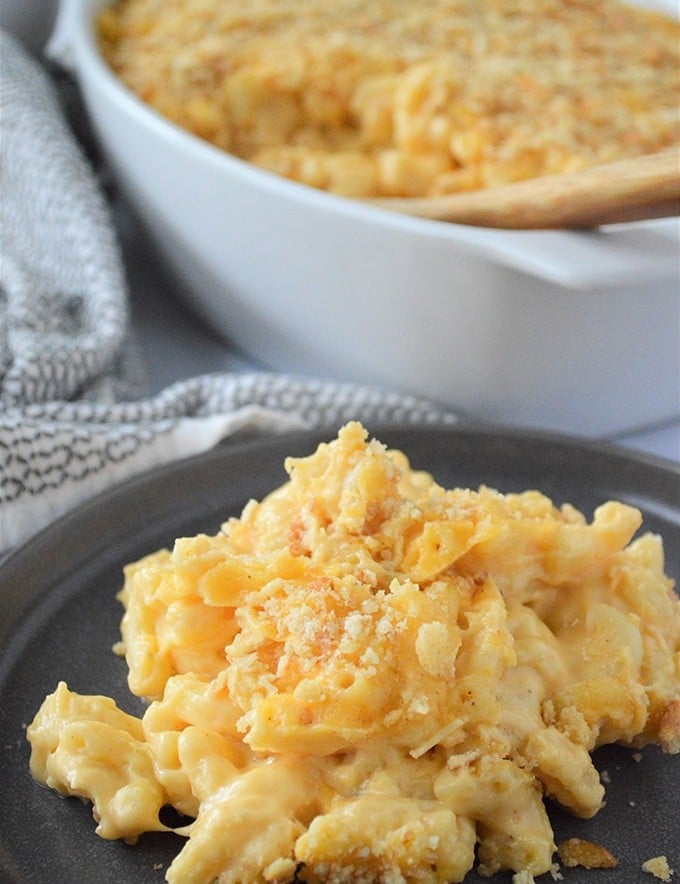 macaroni and cheese on a black serving plate