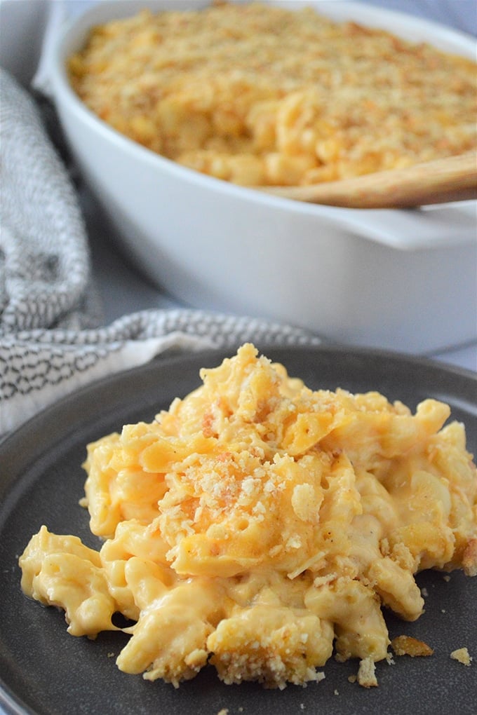 macaroni and cheese on a black serving plate