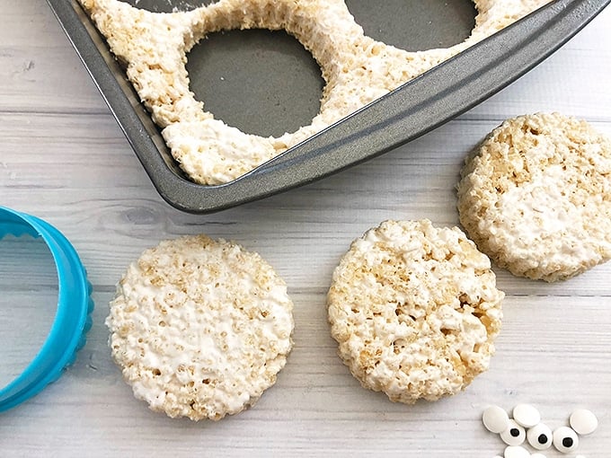 cut a pan of rice krispies treats into circles with cookie cutter