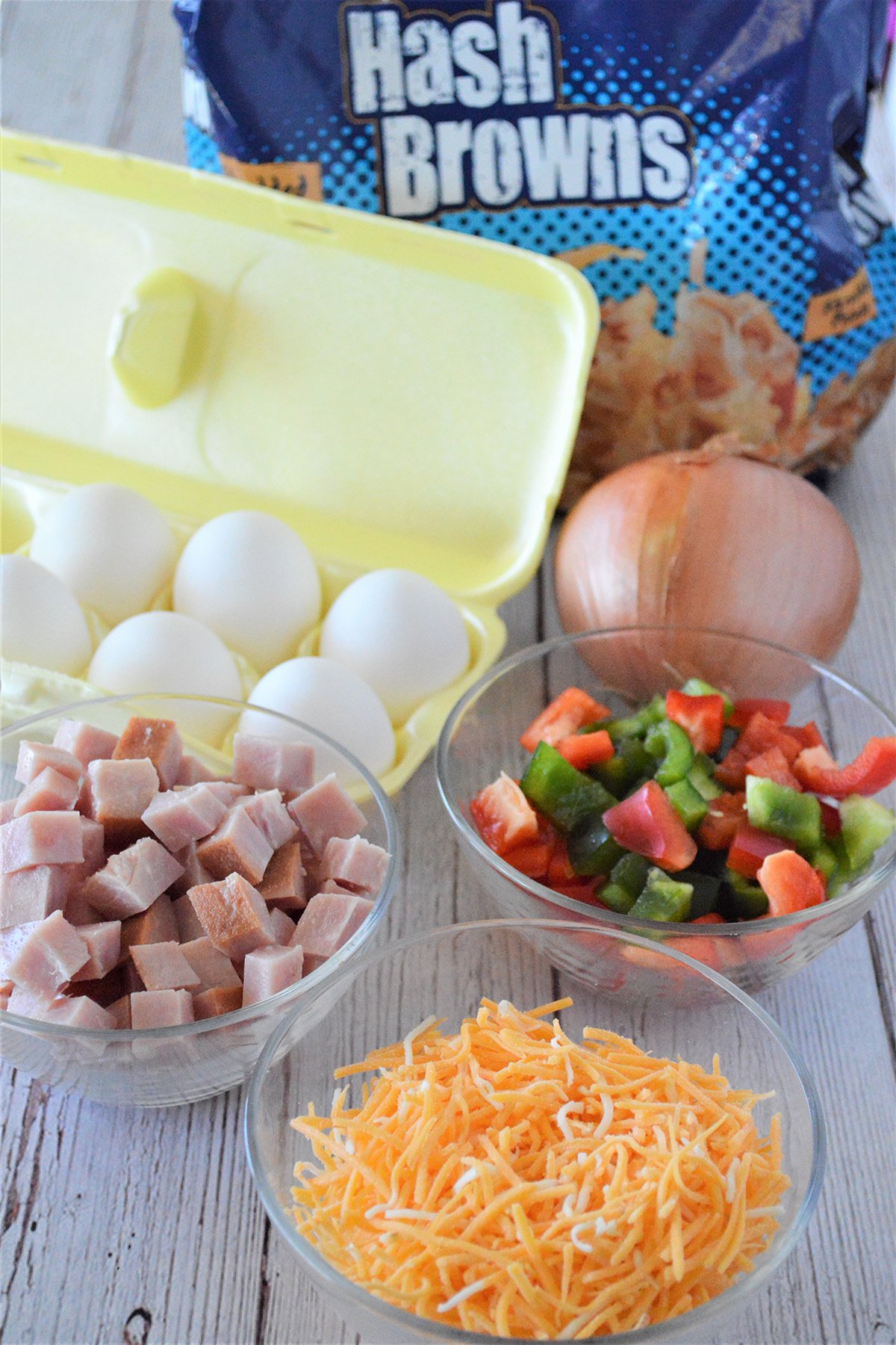 shredded cheese, eggs, diced ham, diced bell peppers, hashbrowns