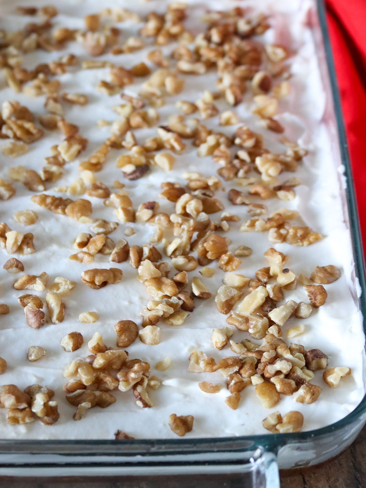 Pineapple Cranberry Jello Salad with whipped topping and chopped walnuts