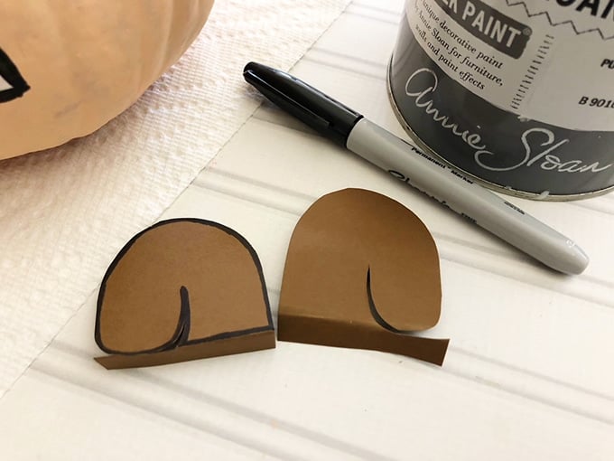 cut out cardstock paper to make squirrel ears for scaredy squirrel pumpkin craft