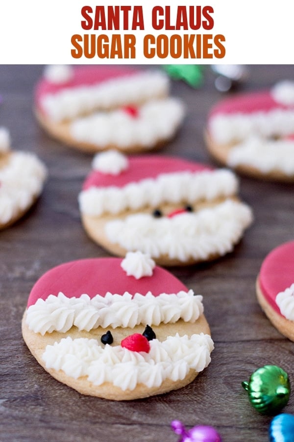 Santa cookies on a wooden board