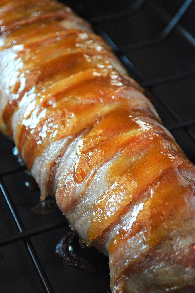 bacon-wrapped pork with brown sugar glaze on roasting rack