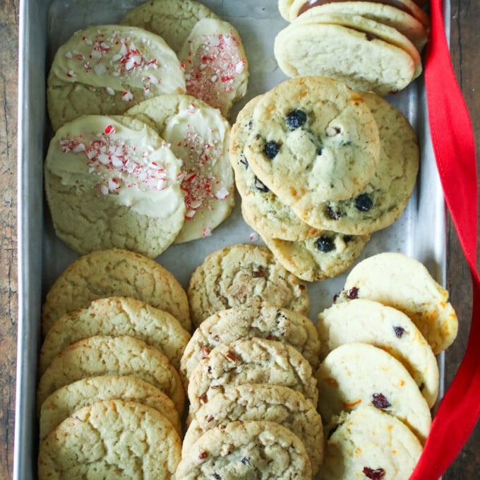 ten fancy cookie flavors made with sugar cookie dough on a baking sheet