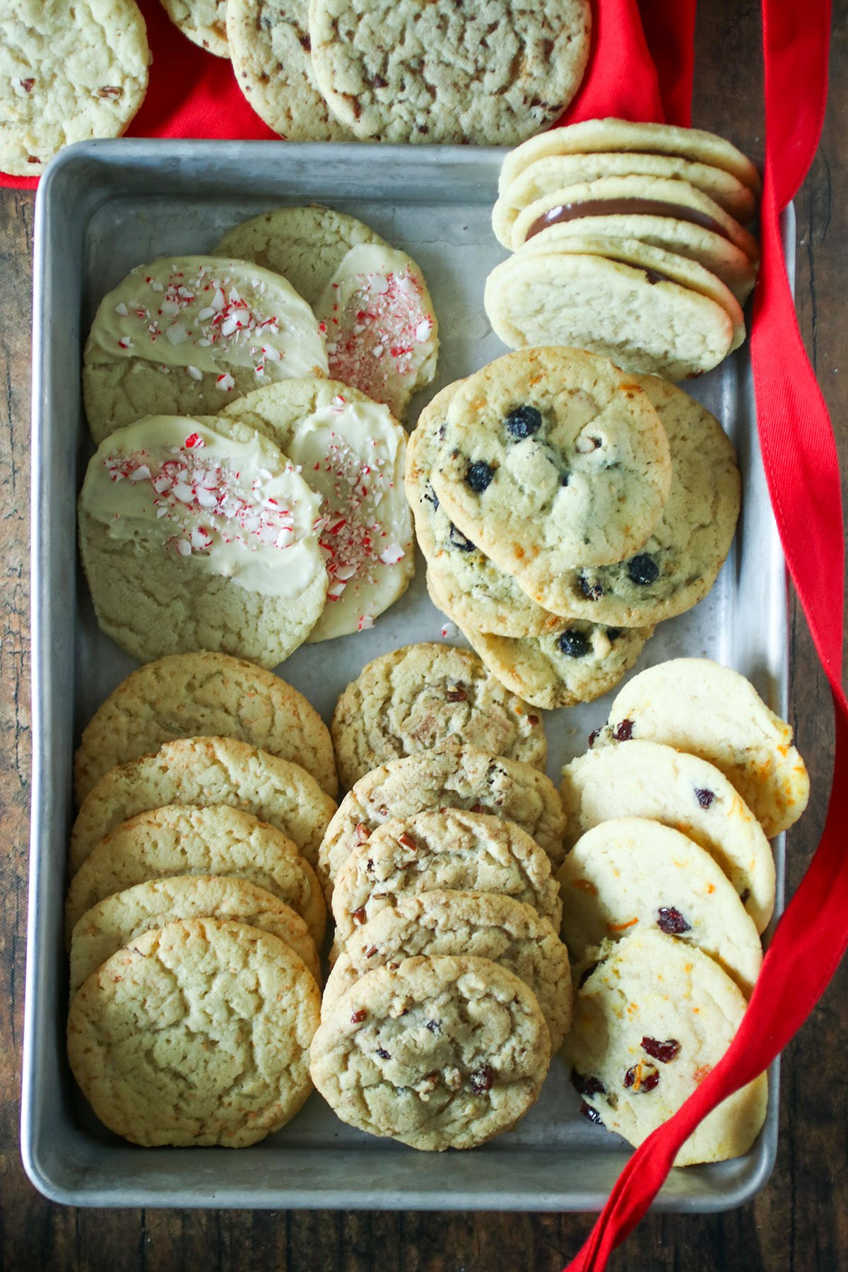 ten fancy cookie flavors made with sugar cookie dough on a baking sheet