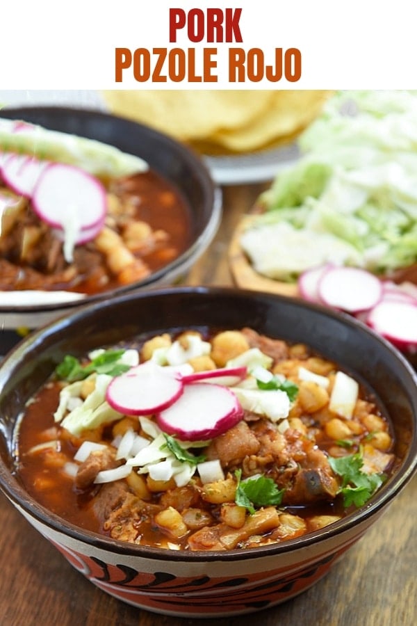 Mexican pozole in a bowl with cabbage, radish, onions, and cilantro