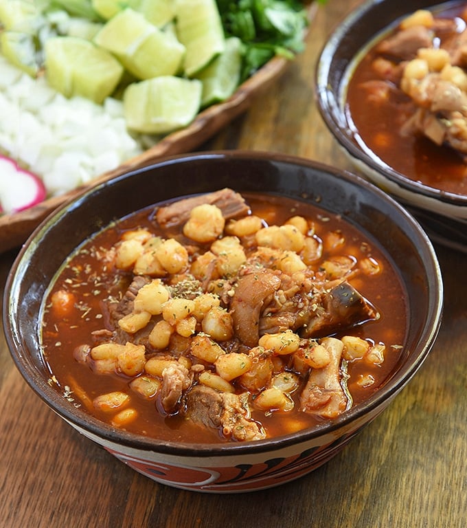 Treat yourself to a dinner of authentic pozole rojo with pork with red chile broth.