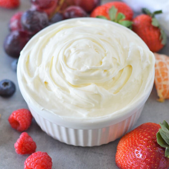 Marshmallow Cream Cheese Fruit Dip in a bowl with fresh fruits on the side