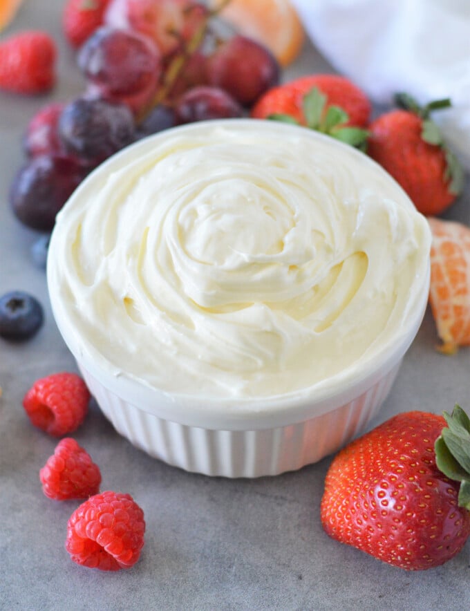 Marshmallow Cream Cheese Fruit Dip in a bowl with fresh fruits on the side