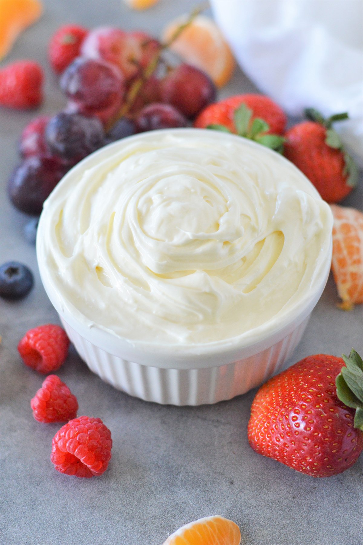 Marshmallow Cream Cheese Fruit Dip in a bowl with fresh fruits on the side