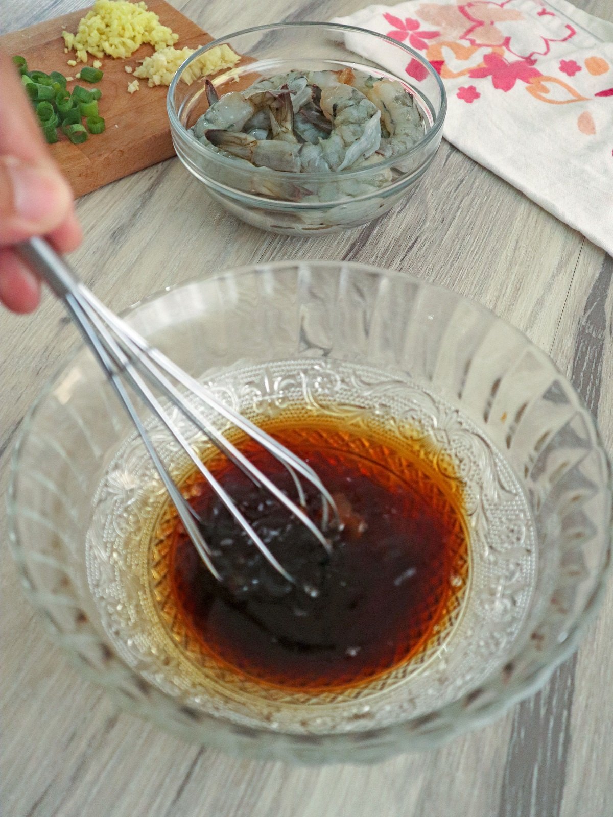 whisking marinade in a bowl