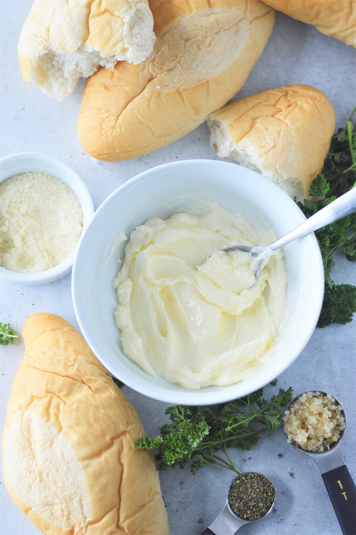 butter, bread loaves, parsley, garlic, herbs.