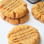 Three-Ingredient Peanut Butter Cookies on a white board.